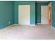 Bedroom with cool blue walls, neutral carpet and a bright window with curtains at 1122 Birkdale Dr, Mebane, NC 27302