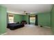 Bedroom features a ceiling fan and two windows for natural light at 1122 Birkdale Dr, Mebane, NC 27302