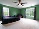 Spacious bedroom with large windows providing ample natural light and a ceiling fan at 1122 Birkdale Dr, Mebane, NC 27302