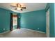 Bright bedroom with carpeting, a ceiling fan, closet, and a window letting in natural light at 1122 Birkdale Dr, Mebane, NC 27302