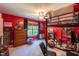 Bedroom with red walls featuring a lofted bed, dresser, and window at 1122 Birkdale Dr, Mebane, NC 27302