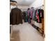 Walk-in closet with ample hanging space and built-in shelving at 1122 Birkdale Dr, Mebane, NC 27302