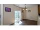Well-lit dining area with wood floors and sliding glass door to outdoor space at 1122 Birkdale Dr, Mebane, NC 27302