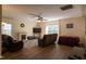 This living room features a fireplace, comfortable seating, a ceiling fan and hard surface flooring at 1122 Birkdale Dr, Mebane, NC 27302