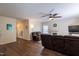 Cozy living room features a fireplace, ceiling fan, comfortable seating and attractive wood-look flooring at 1122 Birkdale Dr, Mebane, NC 27302