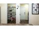 Convenient kitchen pantry with shelving, adjacent to a mudroom and laundry area for added functionality at 1122 Birkdale Dr, Mebane, NC 27302