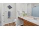 Bathroom features a sink and vanity with laminate wood floor at 1203 First Street Ext, Nashville, NC 27856