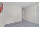 Clean, empty bedroom with a closet and fresh gray carpeting, ready for customization at 1203 First Street Ext, Nashville, NC 27856