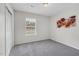 Neutral bedroom with a large window providing ample natural light and closet at 1203 First Street Ext, Nashville, NC 27856