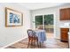 Cozy dining area with sliding glass doors leading to the patio and abundant natural light at 1203 First Street Ext, Nashville, NC 27856