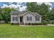 Charming single-story home featuring a well-maintained lawn and classic curb appeal with inviting front entrance and dark shutters at 1203 First Street Ext, Nashville, NC 27856