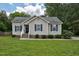 Charming single-story home featuring a well-maintained lawn and classic curb appeal with inviting front entrance and dark shutters at 1203 First Street Ext, Nashville, NC 27856