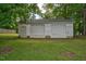 Exterior of a two-car detached garage with white siding and a dark roof at 1203 First Street Ext, Nashville, NC 27856
