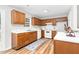 Functional kitchen featuring wood cabinets, white countertops, and modern appliances at 1203 First Street Ext, Nashville, NC 27856