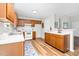 Well-lit kitchen with white countertops, wood cabinets, and an adjacent dining area at 1203 First Street Ext, Nashville, NC 27856