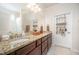 Bathroom features granite countertops, dual sinks, and ample cabinet space for storage at 1204 E Rosedale Creek Dr, Durham, NC 27703