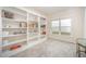 Versatile room featuring tile floor, built-in shelves, and plenty of natural light at 1204 E Rosedale Creek Dr, Durham, NC 27703
