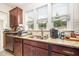 Kitchen boasts granite countertops, stainless steel dishwasher, and double sink with natural light at 1204 E Rosedale Creek Dr, Durham, NC 27703