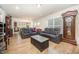 Comfortable living room with hardwood floors, plush seating, and an open floor plan at 1204 E Rosedale Creek Dr, Durham, NC 27703