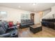 Spacious living area featuring hardwood floors, a cozy sitting area, and ample natural light at 1204 E Rosedale Creek Dr, Durham, NC 27703