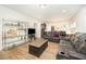 Open living space with hardwood floors, entertainment center, and comfortable seating arrangements at 1204 E Rosedale Creek Dr, Durham, NC 27703