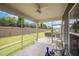 Cozy screened porch offering a relaxing outdoor space with a view of the landscaped backyard at 1204 E Rosedale Creek Dr, Durham, NC 27703