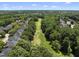 An aerial shot of a golf course community nestled among lush trees and well-maintained homes at 12257 Beestone Ln, Raleigh, NC 27614