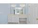 Bathroom vanity with double sinks, ample counter space, and a large mirror at 12257 Beestone Ln, Raleigh, NC 27614