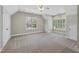 Spacious bedroom with neutral carpet, large windows, and abundant natural light at 12257 Beestone Ln, Raleigh, NC 27614