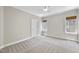 Comfortable carpeted bedroom offering natural light and a soothing atmosphere at 12257 Beestone Ln, Raleigh, NC 27614