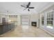 Open floor plan connecting the kitchen and living area with a fireplace at 12257 Beestone Ln, Raleigh, NC 27614