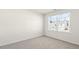 This bedroom is carpeted and has a view of the neighborhood at 132 Pisgah St, Sanford, NC 27330