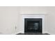 A detailed view of the fireplace with a decorative white mantel at 132 Pisgah St, Sanford, NC 27330