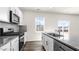 Modern kitchen features stainless steel appliances and granite countertops at 132 Pisgah St, Sanford, NC 27330