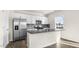 Modern kitchen features stainless steel appliances, and gray tile backsplash at 132 Pisgah St, Sanford, NC 27330