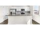 Bright kitchen with stainless steel appliances, granite countertops and island at 132 Pisgah St, Sanford, NC 27330