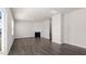 Spacious living area with wood-look floors, a fireplace, and ample natural light at 132 Pisgah St, Sanford, NC 27330