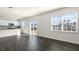 Open-concept living and kitchen area with stainless steel appliances and plenty of light at 132 Pisgah St, Sanford, NC 27330