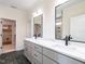 Bathroom features dual sink vanity with white countertop and modern fixtures and hardware at 1328 Bethlehem Church Rd, Youngsville, NC 27596