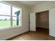 Comfortable bedroom featuring a large window and wood-look flooring at 1328 Bethlehem Church Rd, Youngsville, NC 27596