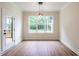 Dining room boasts a large window overlooking a wooded backyard with access to back deck at 1328 Bethlehem Church Rd, Youngsville, NC 27596