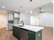 Kitchen features a large island, sleek countertops, modern appliances, and stylish backsplash at 1328 Bethlehem Church Rd, Youngsville, NC 27596