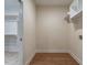 New laundry room boasts wood floors, and convenient shelving and washer/dryer hookups at 1328 Bethlehem Church Rd, Youngsville, NC 27596