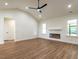 Large living room with wood-look floors, recessed lighting, and an electric fireplace at 1328 Bethlehem Church Rd, Youngsville, NC 27596