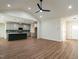 Open-concept living space with a large island, recessed lighting, and wood-look floors at 1328 Bethlehem Church Rd, Youngsville, NC 27596