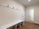 Mud room features built in bench and storage with convenient access to exterior doors at 1328 Bethlehem Church Rd, Youngsville, NC 27596