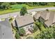 Lovely aerial view of a single Gathering home featuring a wooden deck, stone patio, and manicured landscaping at 1413 Lily Creek Dr, Cary, NC 27518