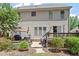 Backyard with patio, deck, and mature trees at 1413 Lily Creek Dr, Cary, NC 27518