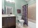 Bathroom with a tub, toilet, and single sink vanity at 1413 Lily Creek Dr, Cary, NC 27518