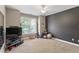 Bedroom with a fan, tv, and window at 1413 Lily Creek Dr, Cary, NC 27518